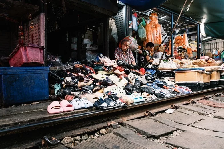 old man selling shoes